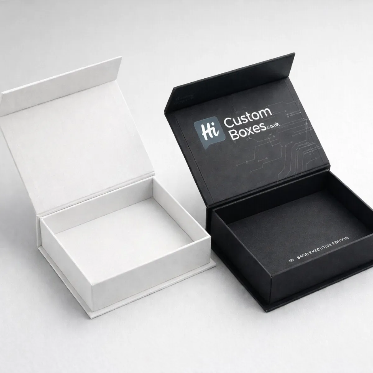 Two premium magnetic flip-top boxes displayed open, featuring a white luxury finish and a black executive edition. class=